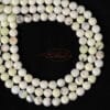 American turquoise ball glossy white-yellow approx. 4-8mm, 1 strand - 4mm